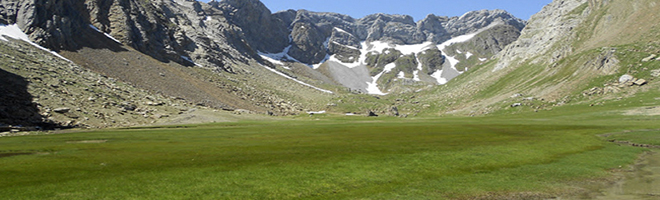 Valle de los Sarrios con su característica pared al fondo.